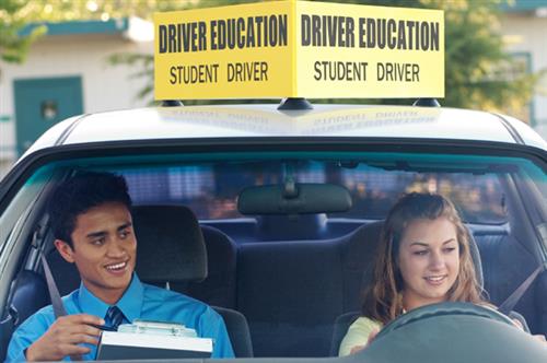 Instructor Rohner teaching a student to drive. 